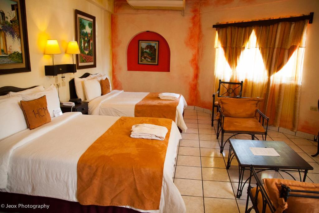 Postel nebo postele na pokoji v ubytování Hotel Camino Maya