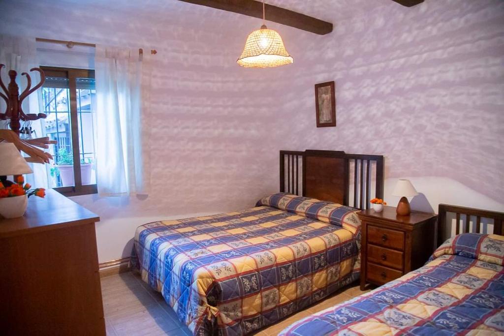 Postel nebo postele na pokoji v ubytování Aldea de Boche
