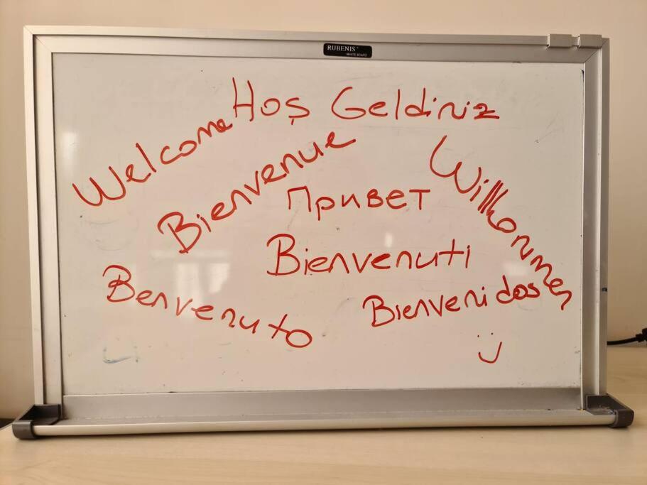 a whiteboard with writing on the side of it at Save your money for travels stay here low cost. in Konak