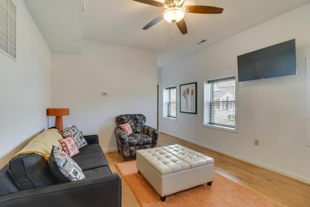 a living room with a couch and a ceiling fan at Cozy Marlinton Vacation Rental Downtown Location! in Marlinton