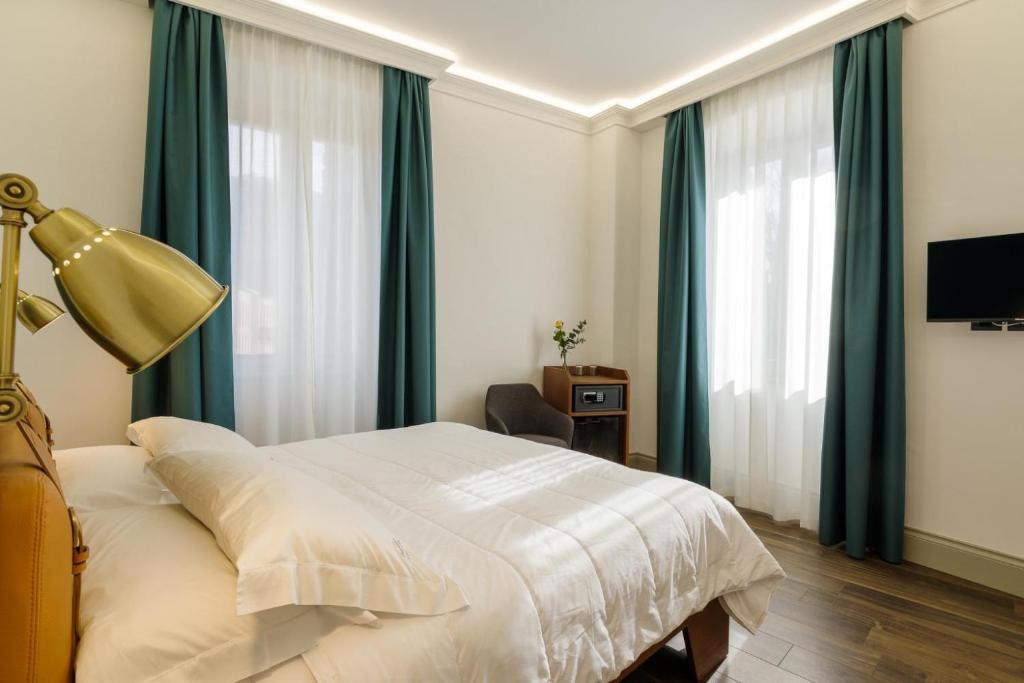 Postel nebo postele na pokoji v ubytování Palazzo Fontana
