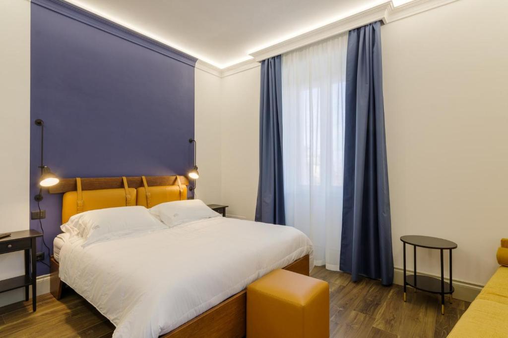 Postel nebo postele na pokoji v ubytování Palazzo Fontana