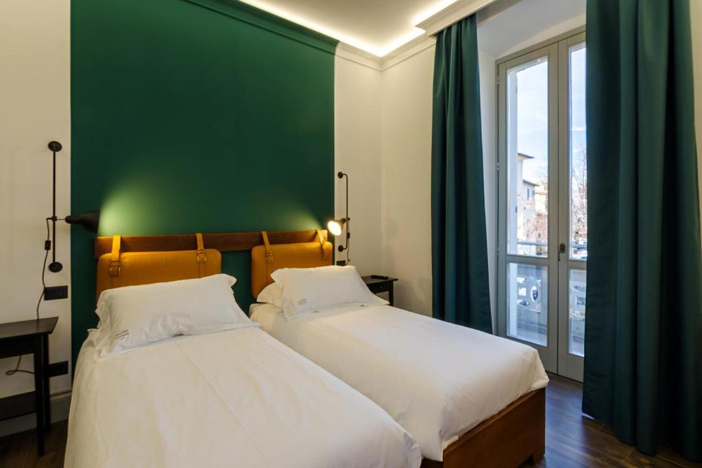 Postel nebo postele na pokoji v ubytování Palazzo Fontana