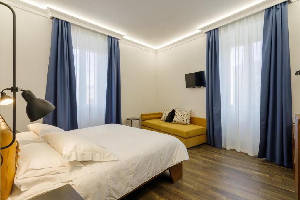 Postel nebo postele na pokoji v ubytování Palazzo Fontana