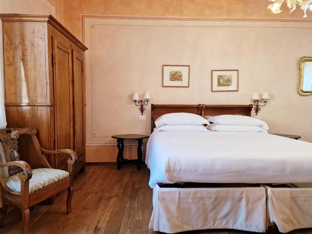 Postel nebo postele na pokoji v ubytování Relais Vimercati