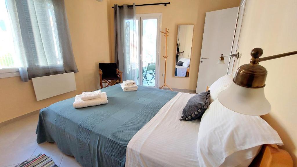 A bed or beds in a room at Epameinondas Luxury House