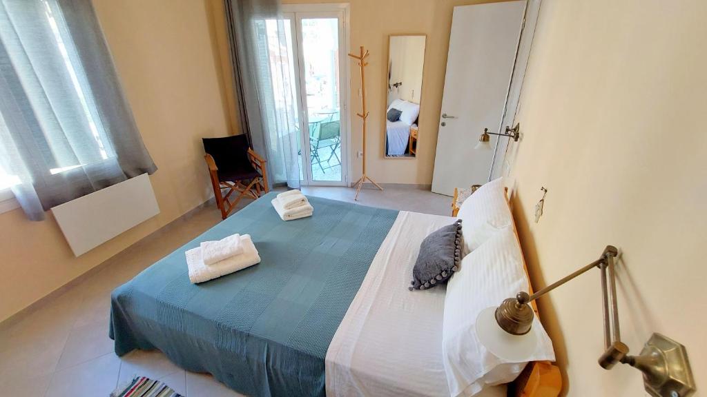 A bed or beds in a room at Epameinondas Luxury House