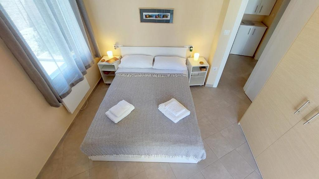 A bed or beds in a room at Epameinondas Luxury House