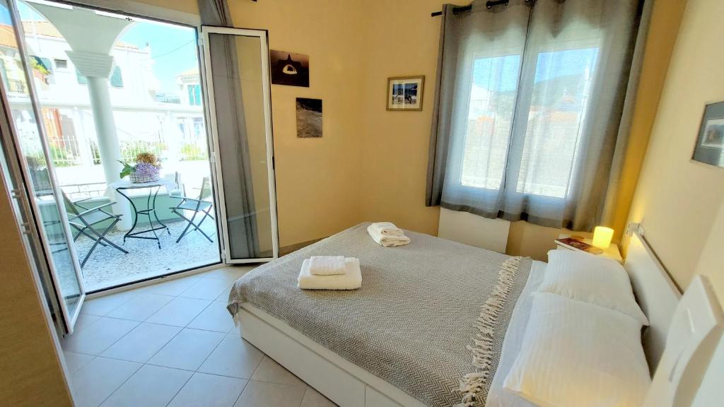 A bed or beds in a room at Epameinondas Luxury House
