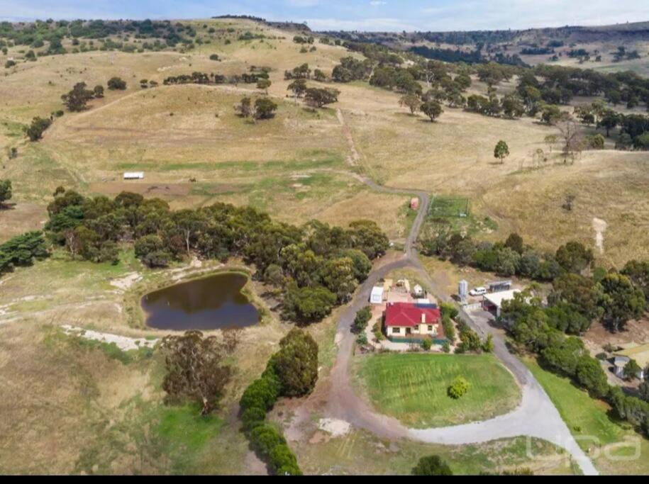 an aerial view of a house on a hill at 4 bedrooms Relaxing farmhouse getaway in Glenmore 