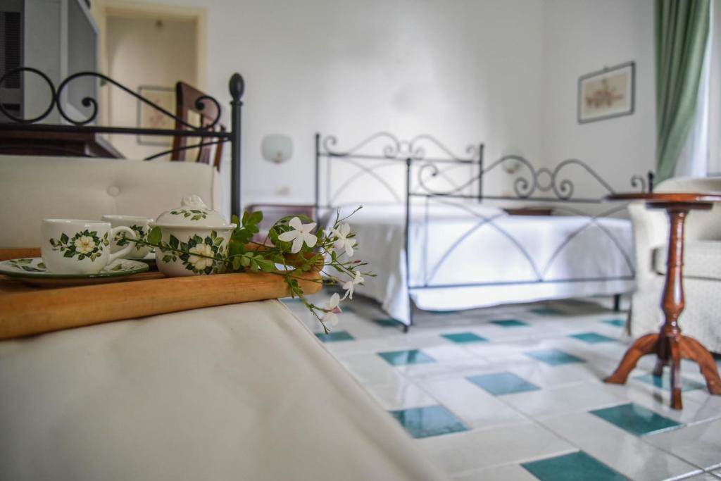 Postel nebo postele na pokoji v ubytování Villa Fiorita Lipari - Villa Fiori di Campo