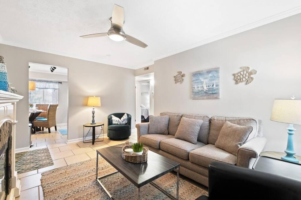 a living room with a couch and a table at 5 MIN WALK TO BEACH- 2BR1BA Villa in The Dunes in Hilton Head Island