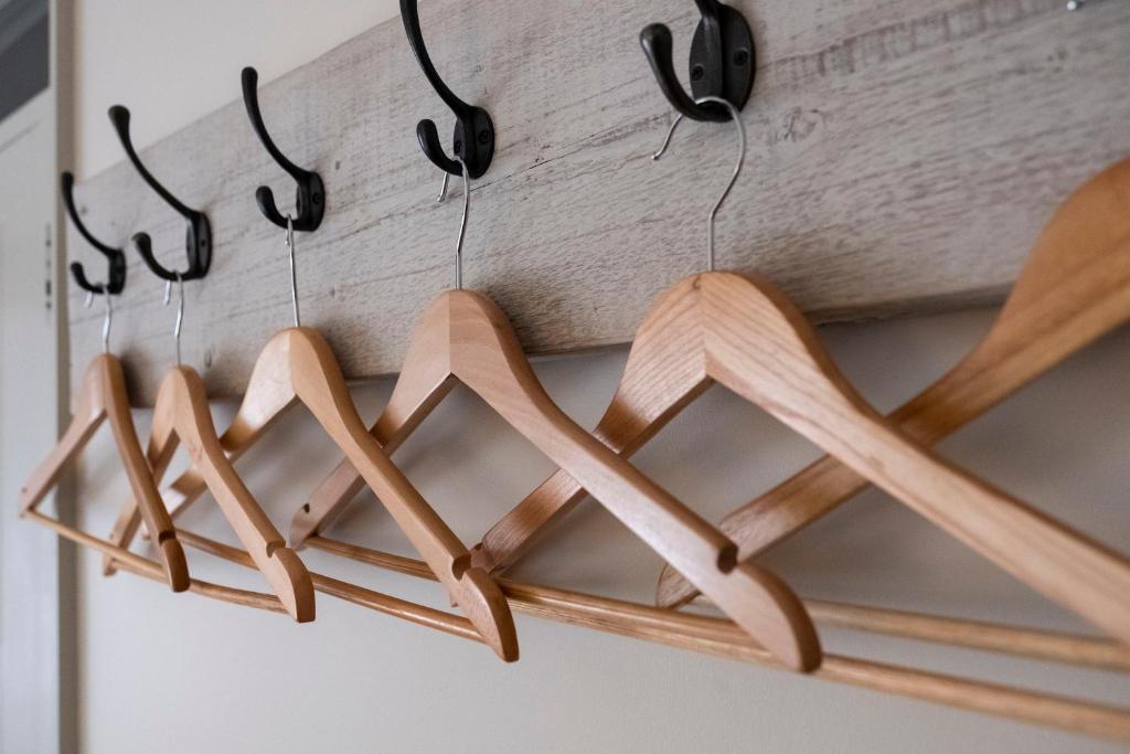 a group of woodenoons hanging from a wall at The Ship At Dunwich in Dunwich