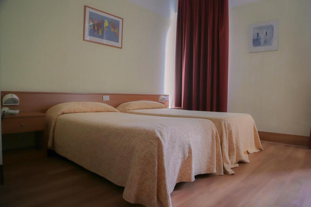 Postel nebo postele na pokoji v ubytování Hotel Fortuna