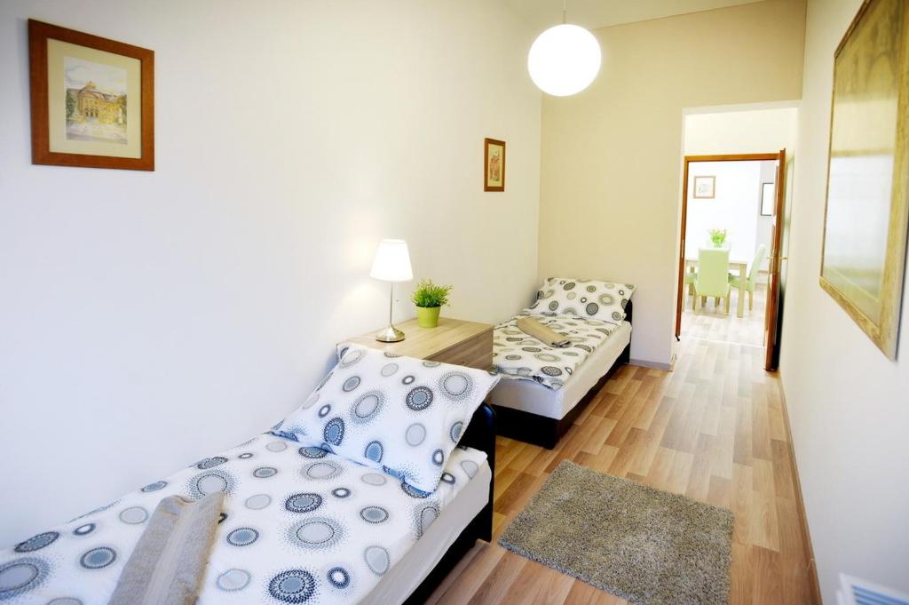 Posteľ alebo postele v izbe v ubytovaní Corner Apartman Eger