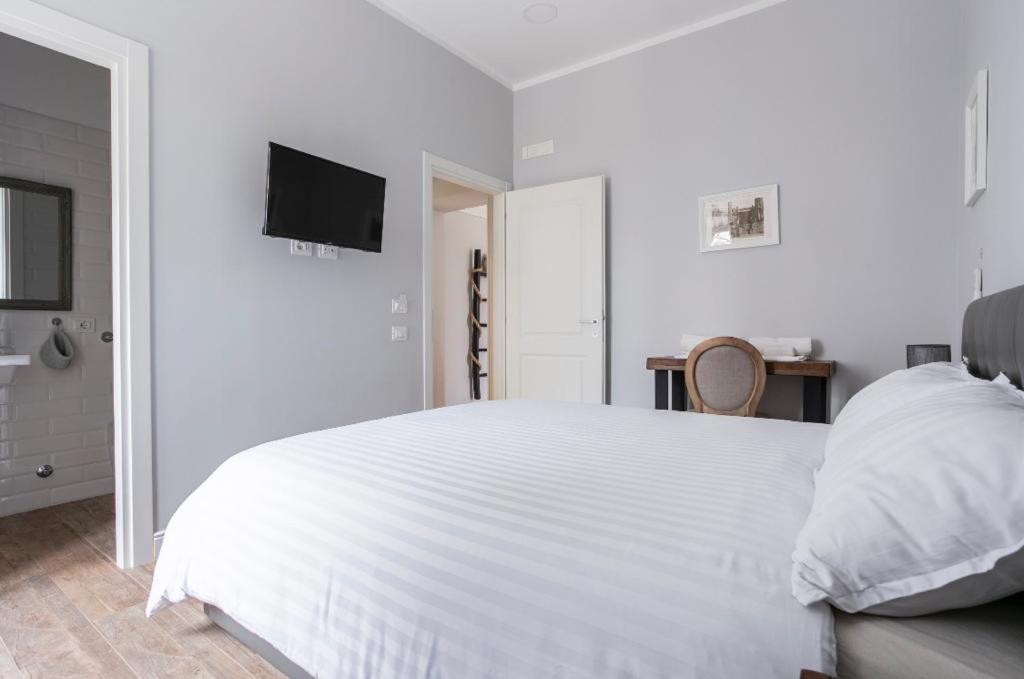 Postel nebo postele na pokoji v ubytování Casaletto's Suites