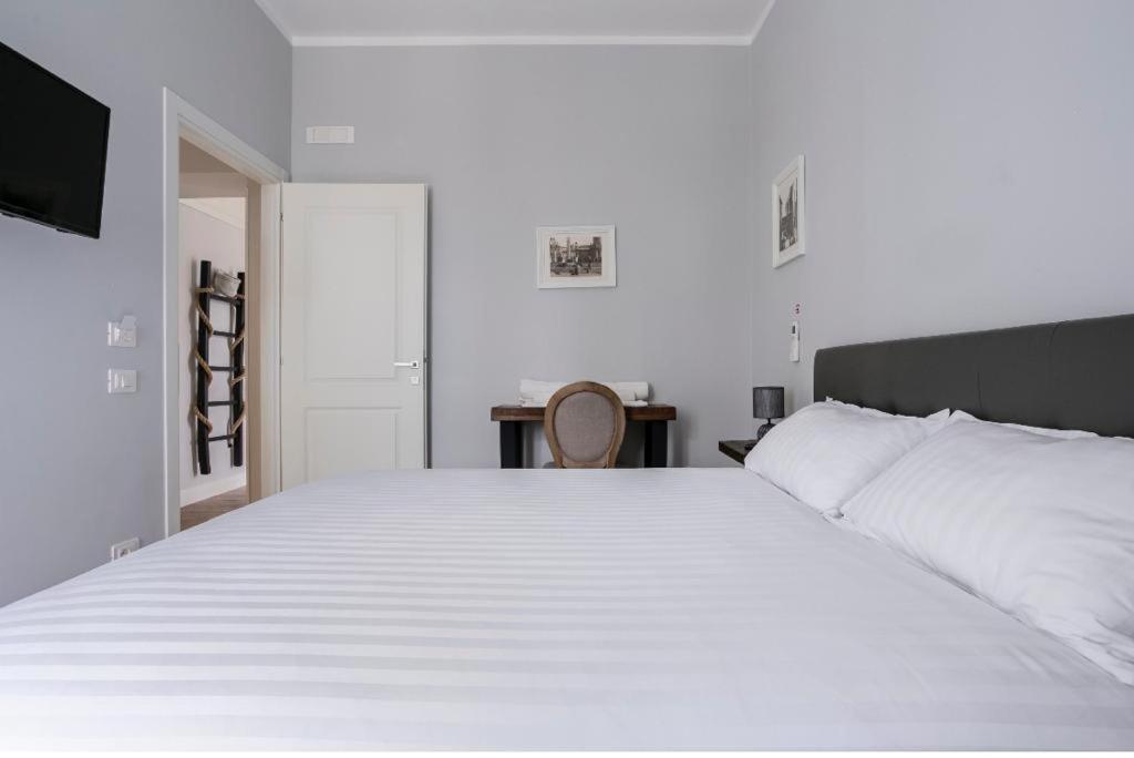 Postel nebo postele na pokoji v ubytování Casaletto's Suites