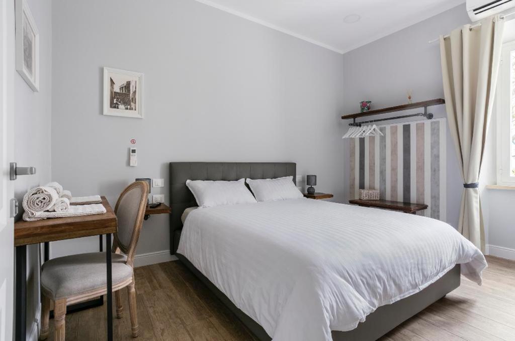 Postel nebo postele na pokoji v ubytování Casaletto's Suites