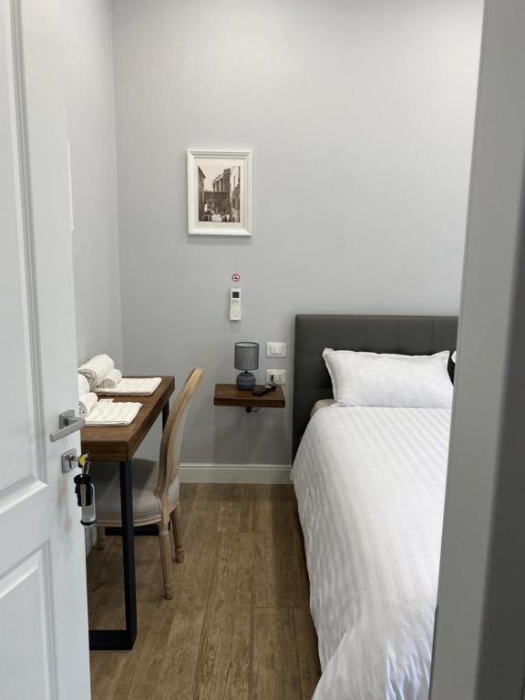Postel nebo postele na pokoji v ubytování Casaletto's Suites
