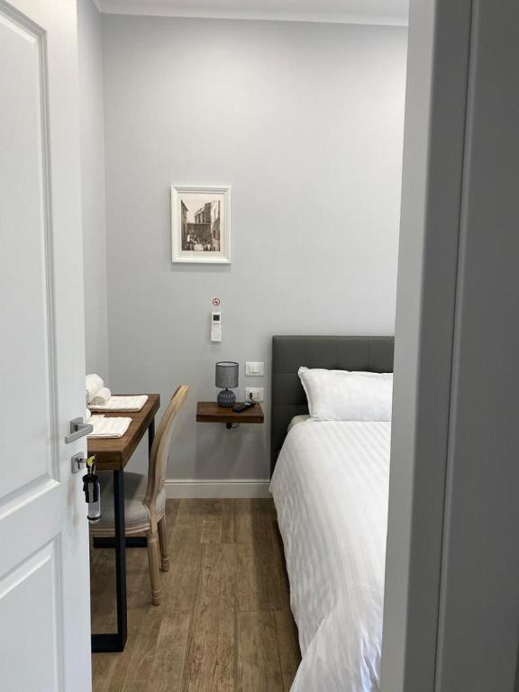 Postel nebo postele na pokoji v ubytování Casaletto's Suites