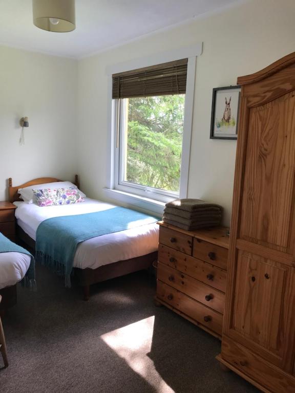 Postel nebo postele na pokoji v ubytování Glengarry Lodge