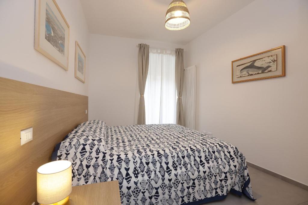 Postel nebo postele na pokoji v ubytování Adamaina - Sea view apartment with private garage
