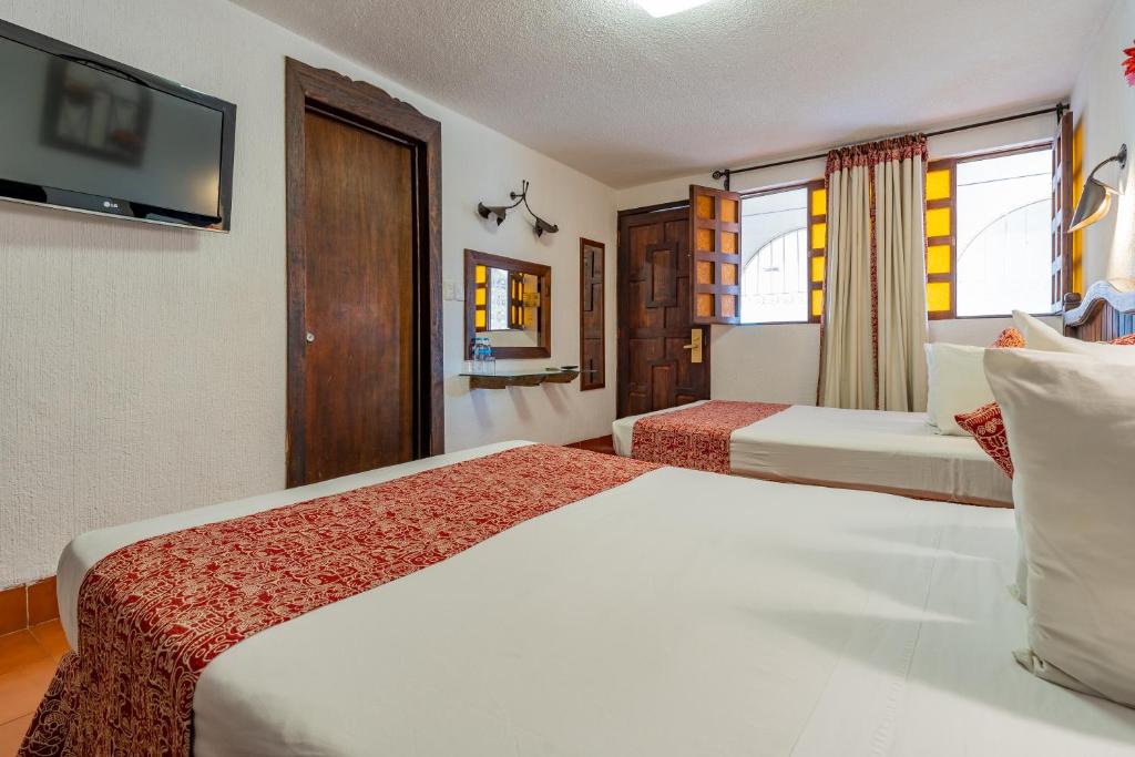 Postel nebo postele na pokoji v ubytování Hotel Maya Yucatan