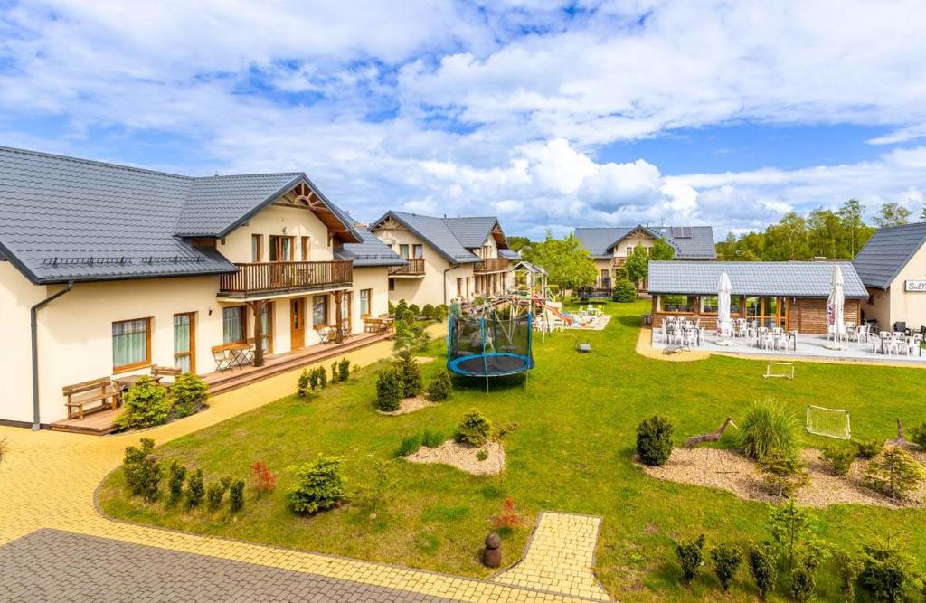 an aerial view of a house with a playground at Villa Sul Mare in Dębki