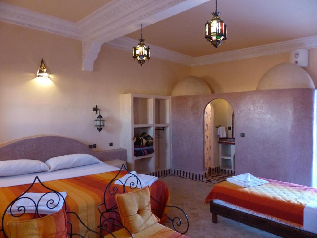 Postel nebo postele na pokoji v ubytování Auberge La Source