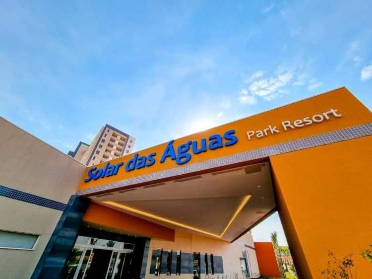 a store with a sign on the front of it at Enjoy Solar das Águas Park Resort in Olímpia
