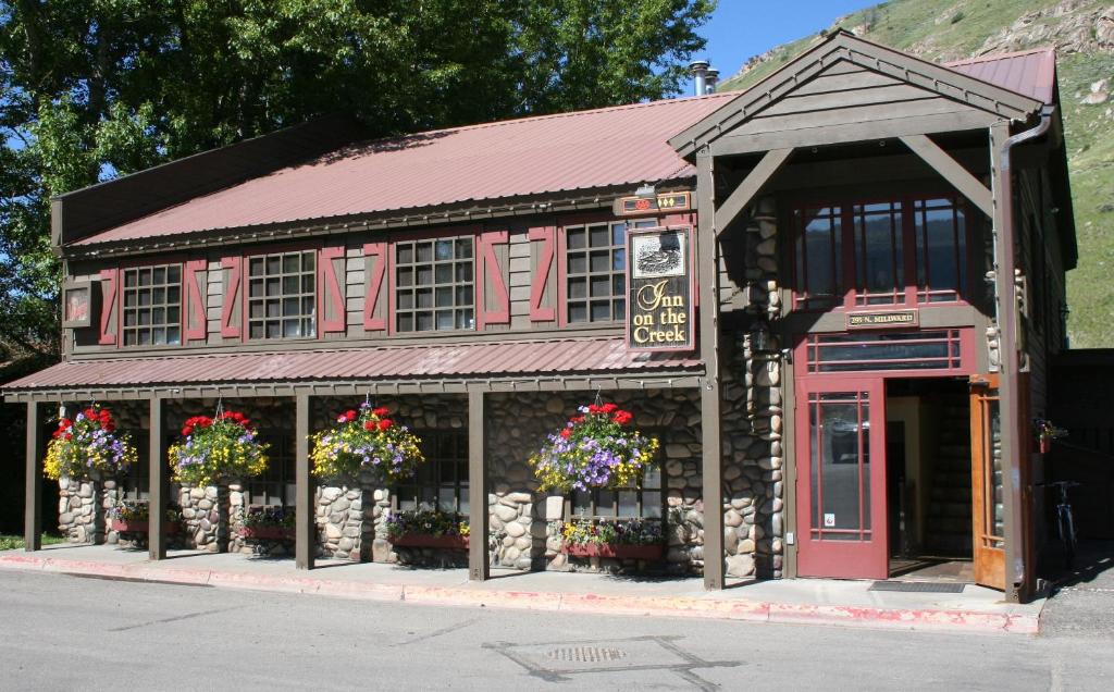 a building with a red phone booth in front of it at Inn on The Creek in Jackson