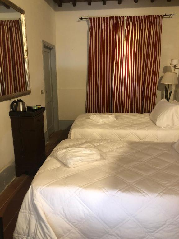 Postel nebo postele na pokoji v ubytování Albergo Le Casaline