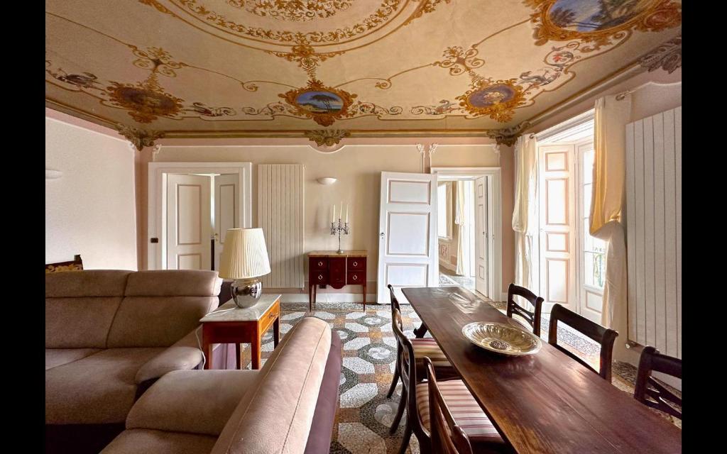 a living room with a couch and a table at Cà del Conte Lake Como in Tremezzo