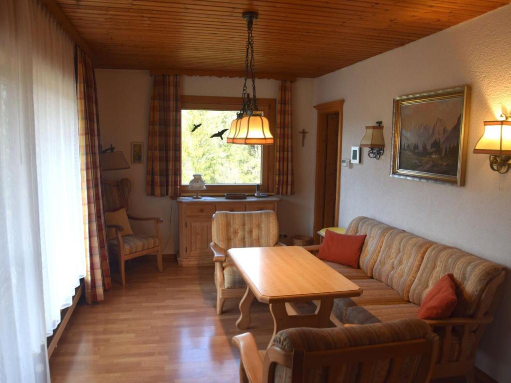 a living room with a couch and a table at Holiday home Karwendel in Füssen