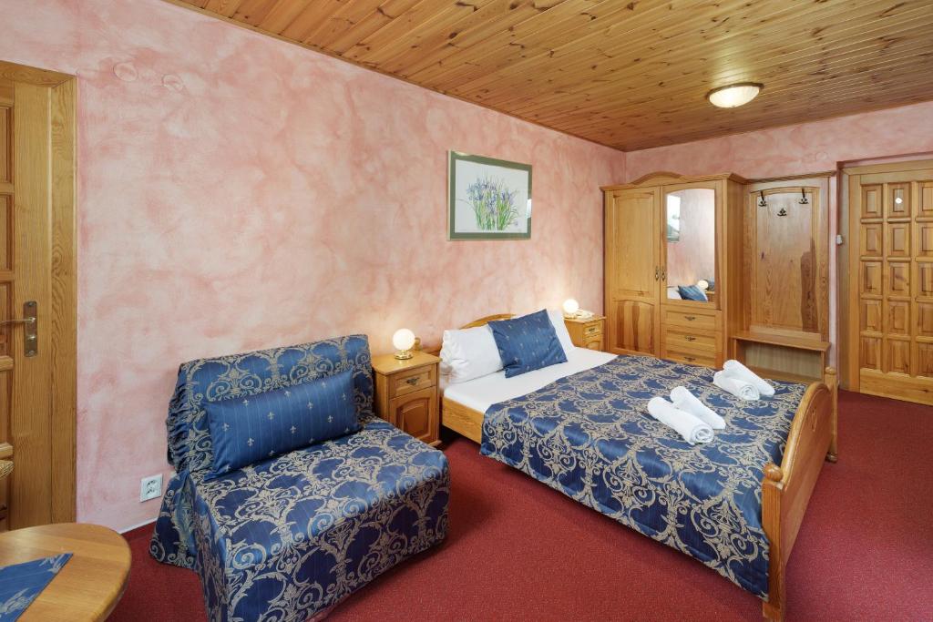 Postel nebo postele na pokoji v ubytování Hotel Resort Martin & Kristyna
