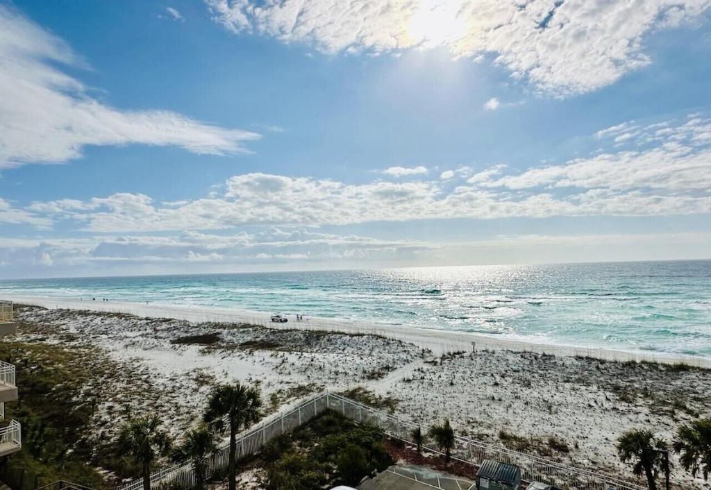 a view of a beach with the ocean at A Wave From It All in Pensacola Beach
