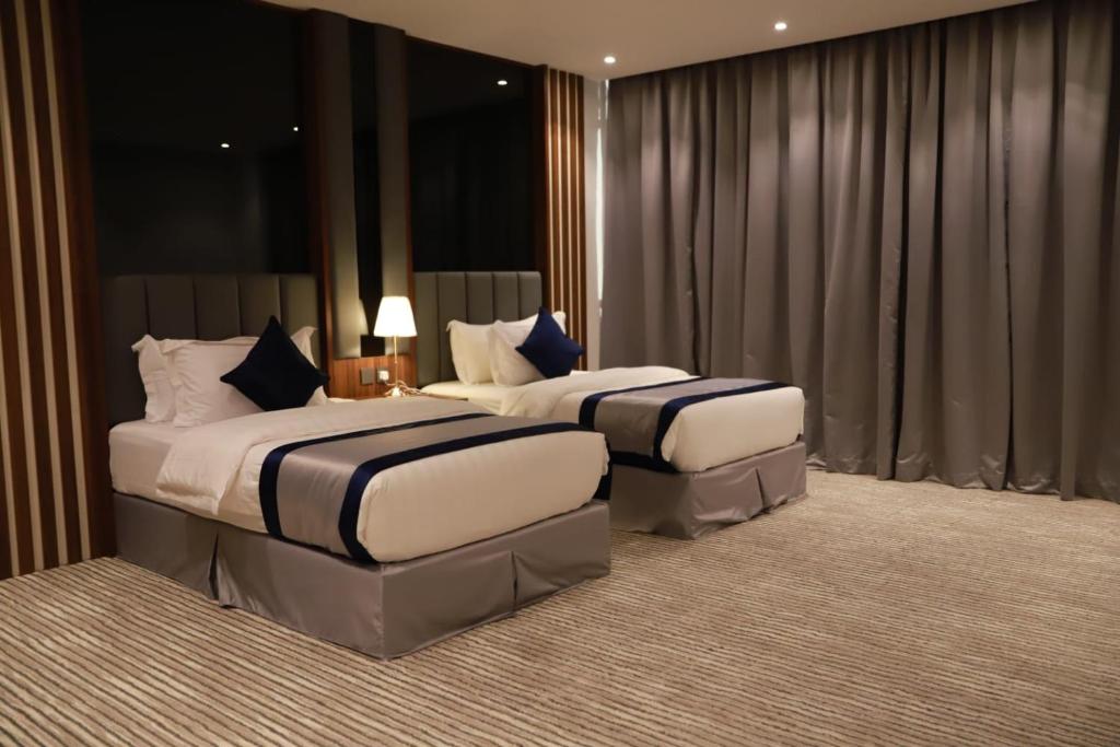 Postel nebo postele na pokoji v ubytování Tulip View Hotel