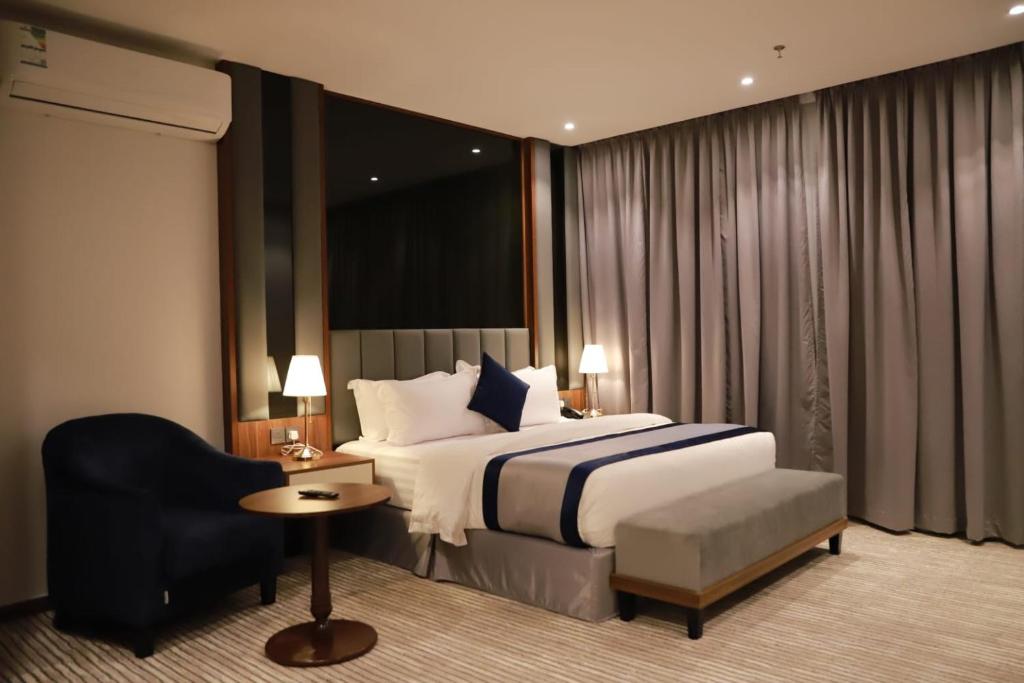 Postel nebo postele na pokoji v ubytování Tulip View Hotel