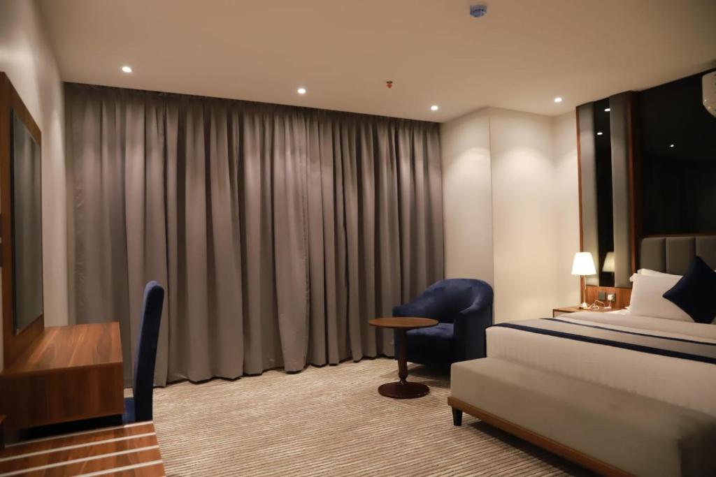 Postel nebo postele na pokoji v ubytování Tulip View Hotel