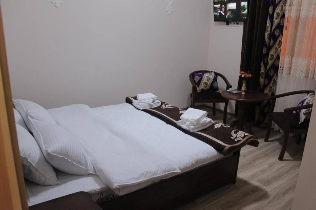 Ένα ή περισσότερα κρεβάτια σε δωμάτιο στο Uzbek House