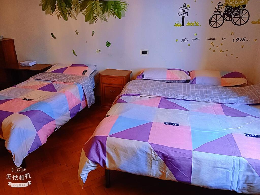 Ένα ή περισσότερα κρεβάτια σε δωμάτιο στο 旅途之家