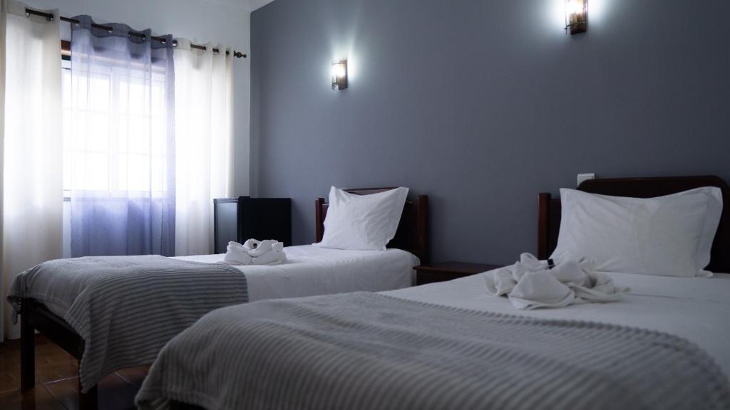 Posteľ alebo postele v izbe v ubytovaní Casa das Termas