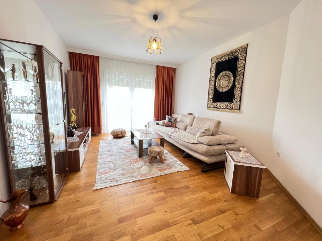 a living room with a couch and a table at Lucky Apartments II in Pristina