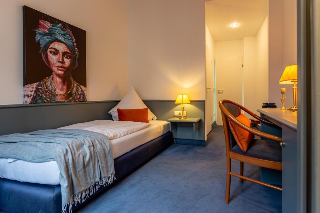 Postel nebo postele na pokoji v ubytování Hotel Mauritius - Im Herzen von Crimmitschau - Frühstück buchbar - Restaurant - Café - Fahrradbox