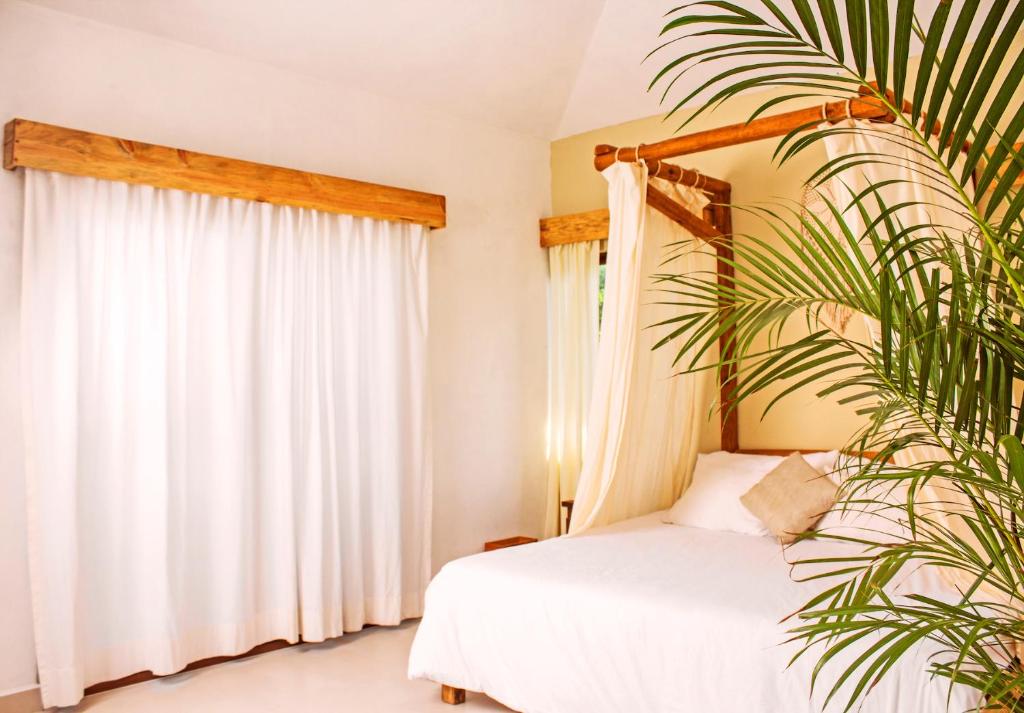Postel nebo postele na pokoji v ubytování Mezcal Hotel