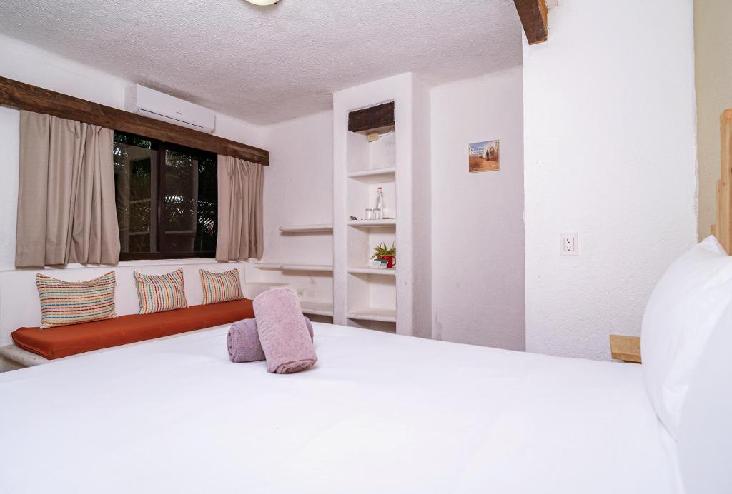 Postel nebo postele na pokoji v ubytování Mezcal Hotel