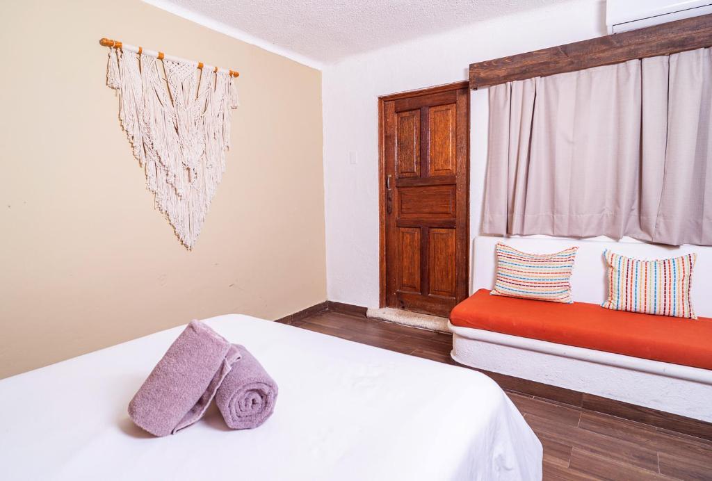Postel nebo postele na pokoji v ubytování Mezcal Hotel