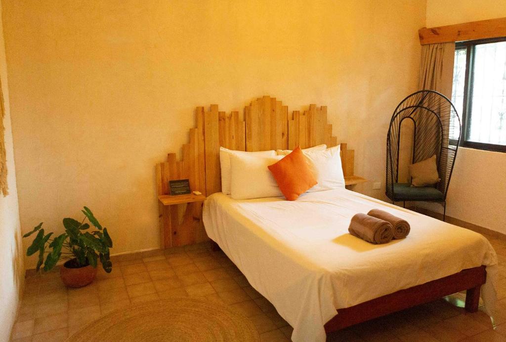 Postel nebo postele na pokoji v ubytování Mezcal Hotel