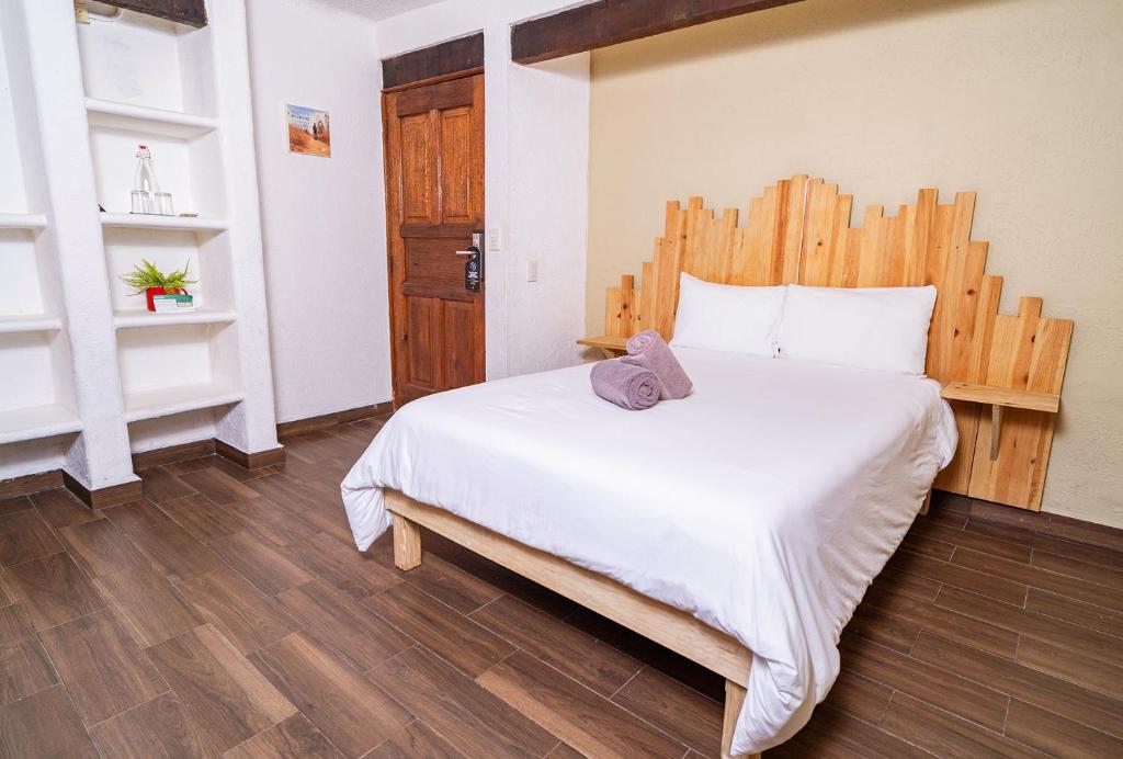 Postel nebo postele na pokoji v ubytování Mezcal Hotel