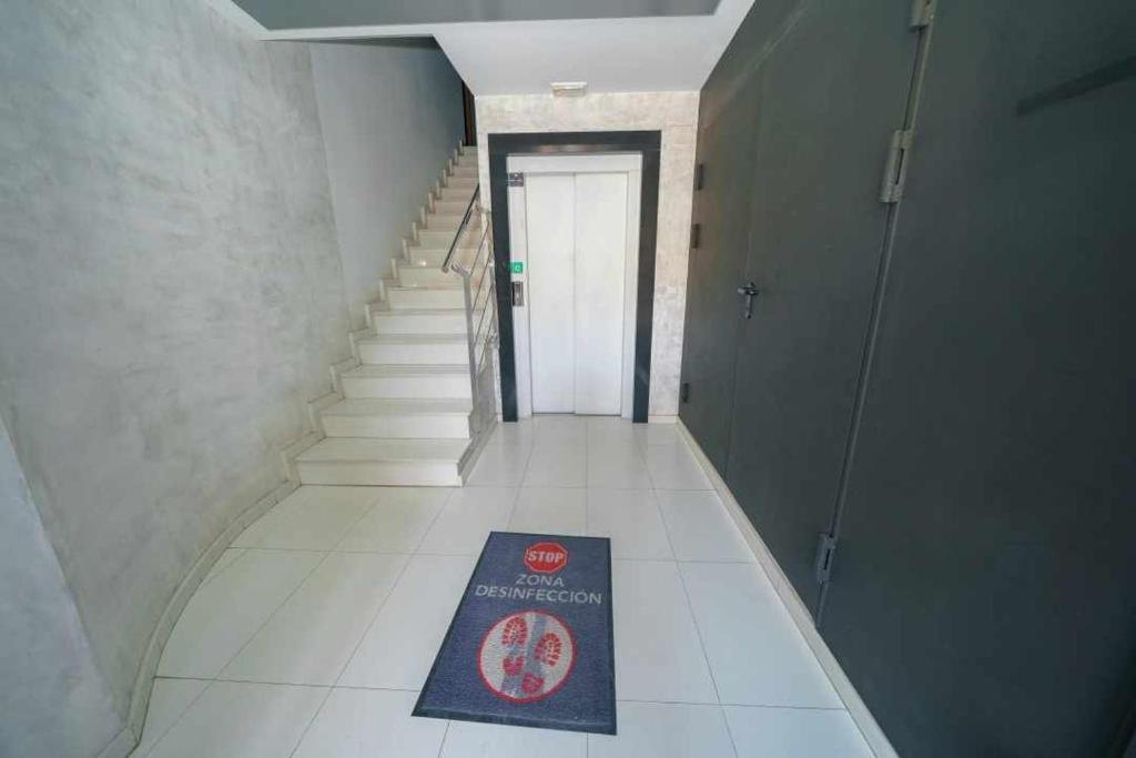 a staircase with a book on the floor in a building at Apartamentos Doctor Clara in Castellón de la Plana